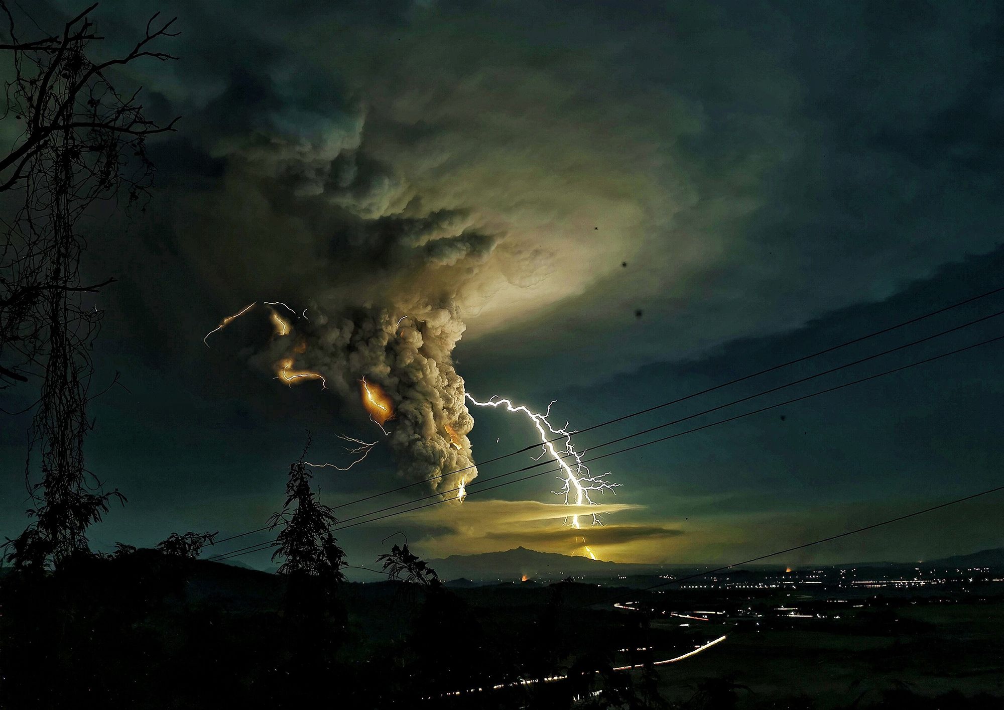 Lightning strikes over Batangas as Taal volcano erupts in the Philippines, on Jan. 12.