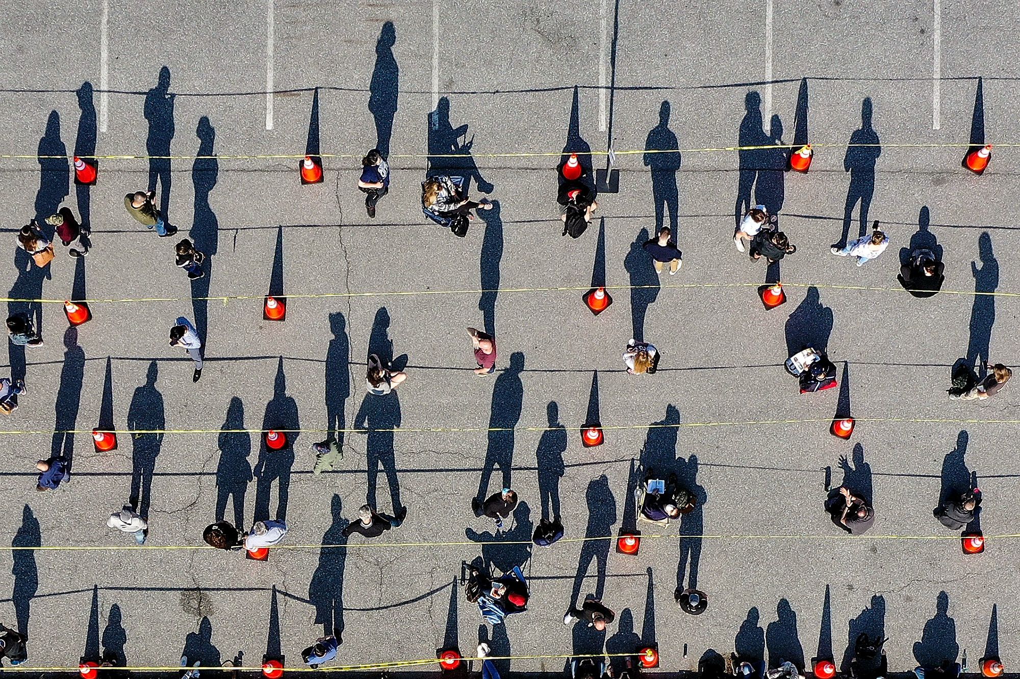 People wait outside a mass vaccination site at Hagerstown Premium Outlets in Hagerstown, Md., on April 7, after the site announced it was open to walk-ups.