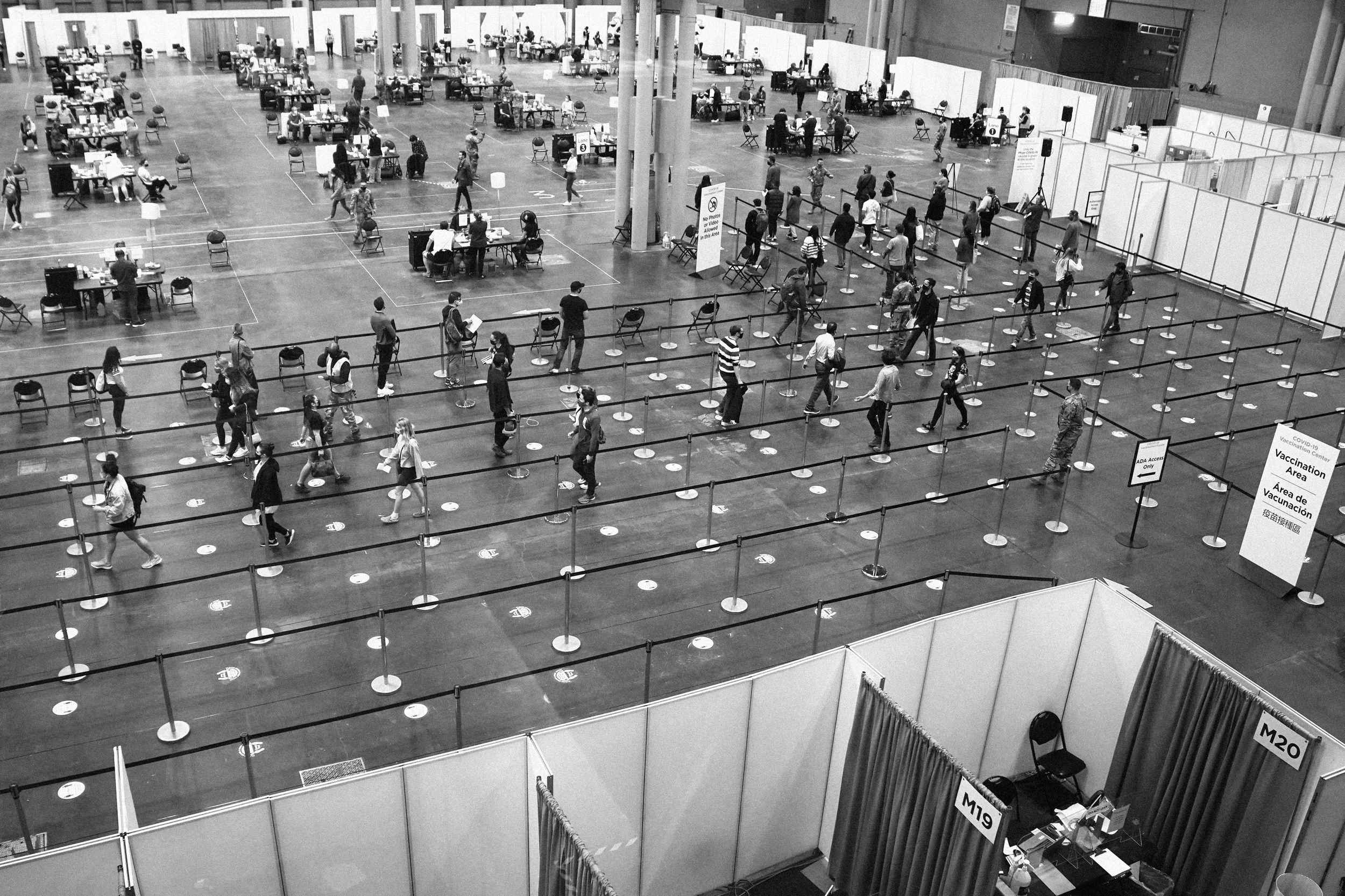 People wait in line at the Jacob K. Javits Convention Center for Covid-19 vaccinations in New York on April 6, 2021