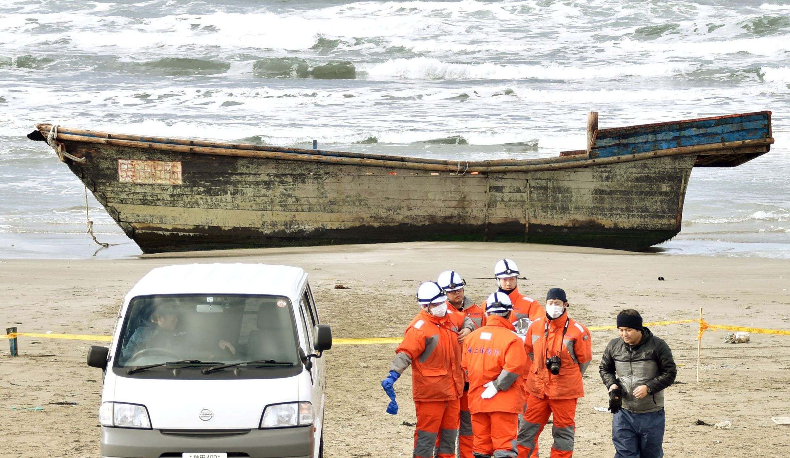 A wooden boat, which drifted ashore with eight partially skeletal bodies and was found by the Japan Coast Guard, in Oga, Akita Prefecture, Japan, on Nov. 27, 2017.