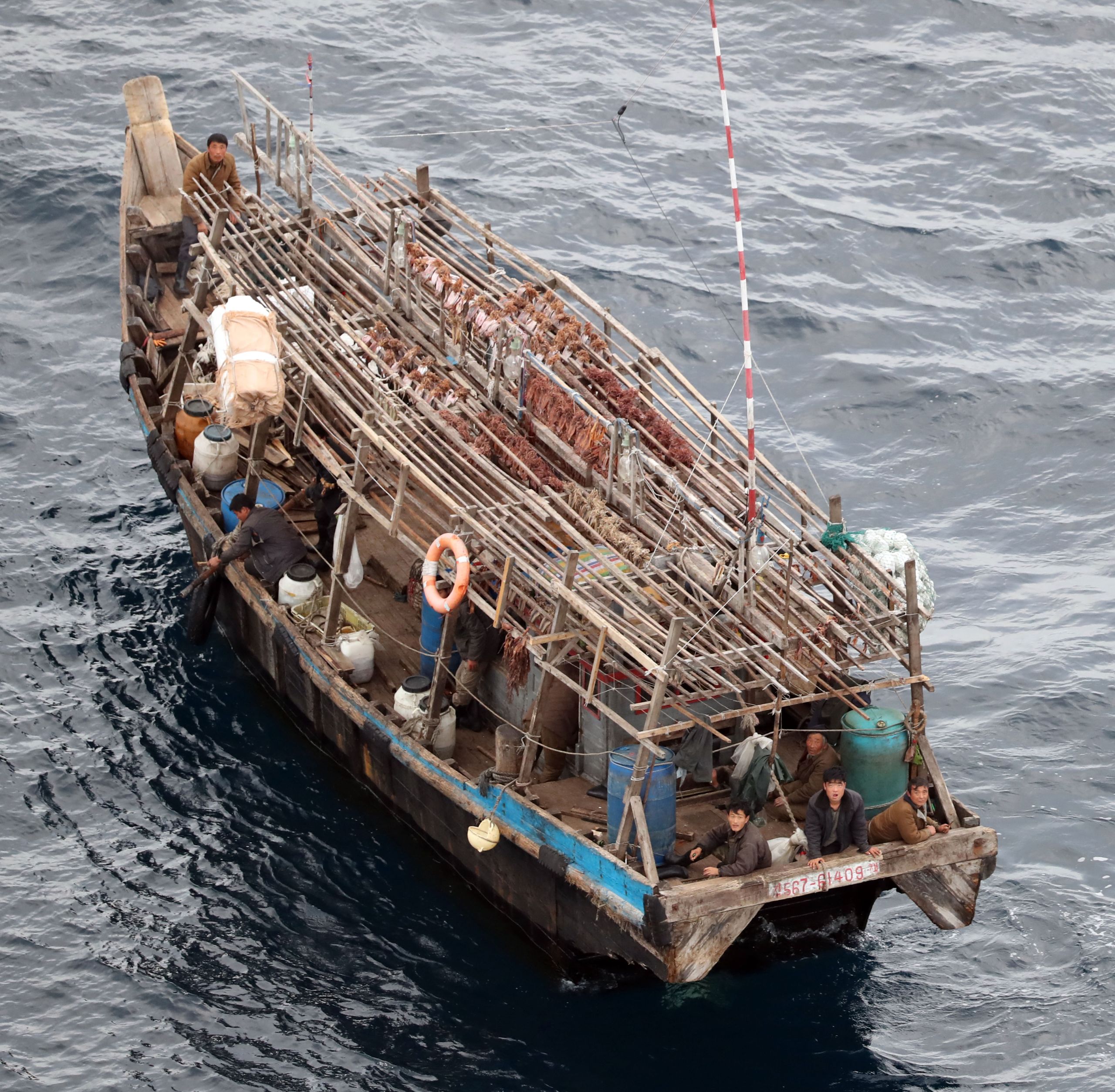 A fish boat of unknown nationality with squids drying on the roof off the northwest of Noto Peninsula, Ishikawa prefecture, Japan on Oct. 7, 2019.