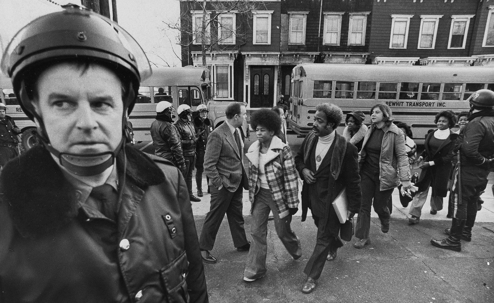 Police were on hand to provide protection as buses carrying Black students arrived at South Boston High School on Jan. 8, 1975.