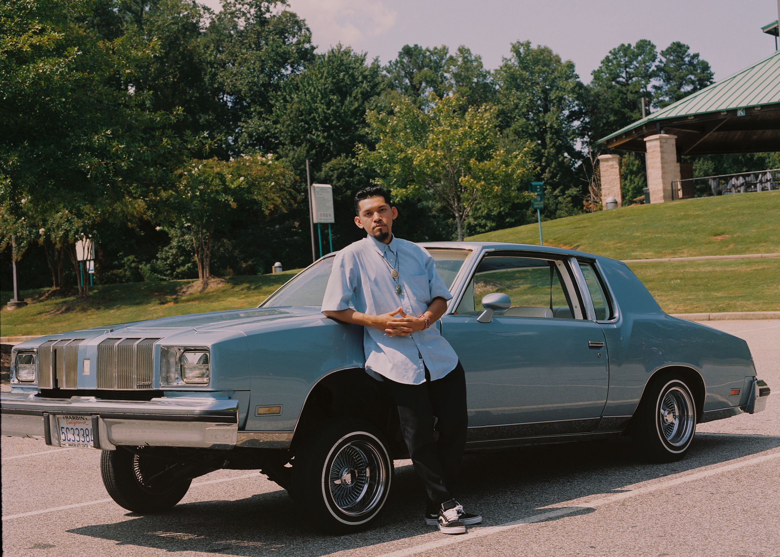 Alfredo Corona with his car at Rhodes Jordan Park in Lawrenceville, Ga., on Sept 10. (Piera Moore for NBC News)