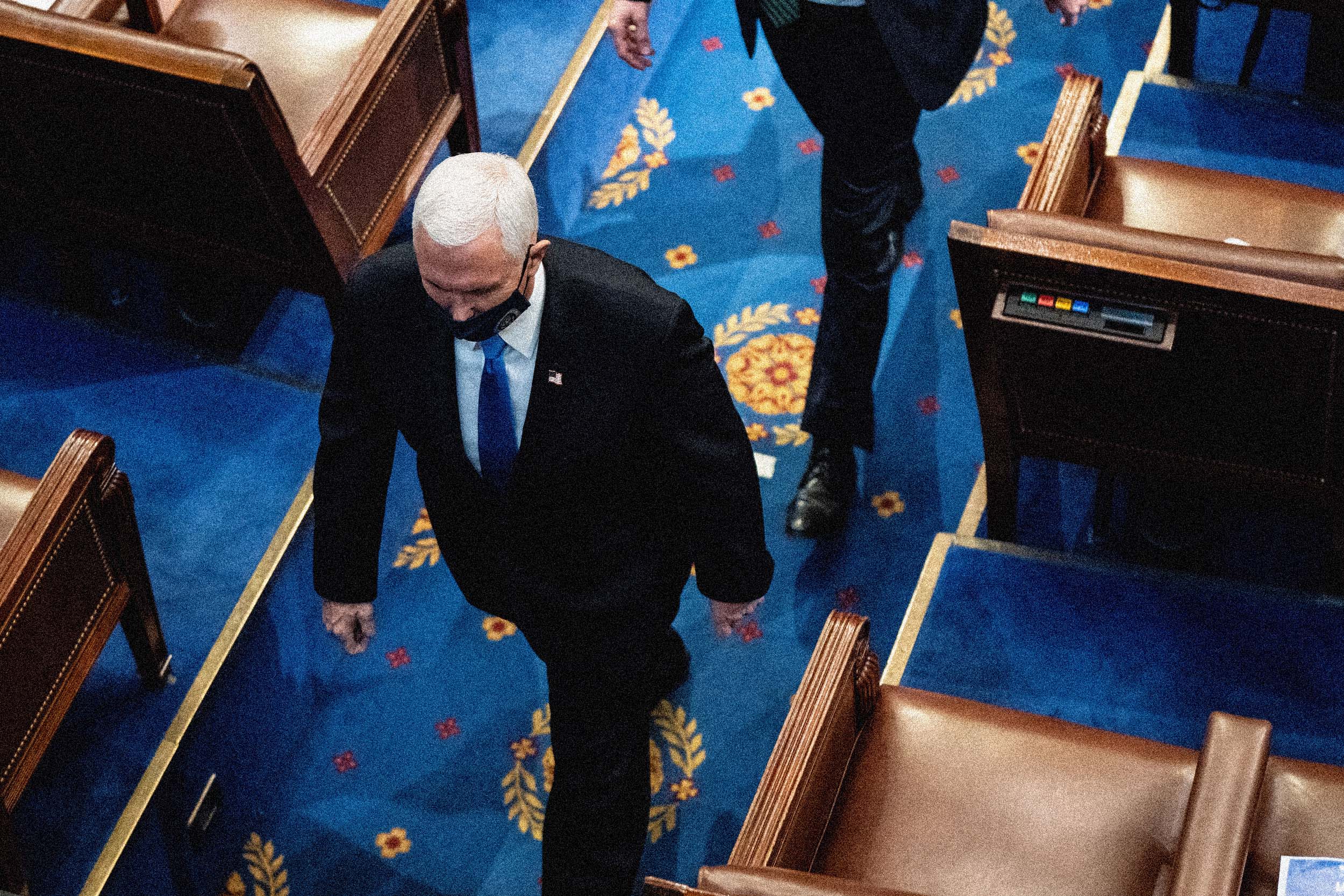 Then-Vice President Mike Pence leaves the House floor during the certification of electoral college votes at the Capitol. (Erin Schaff / Pool via Getty Images file)