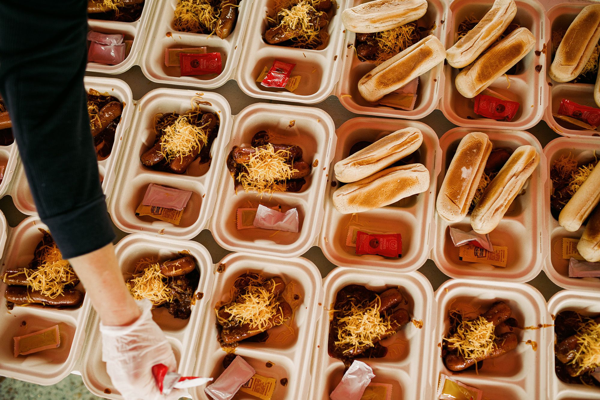Hot meals are prepared for distribution. (Bryan Tarnowski for NBC News)