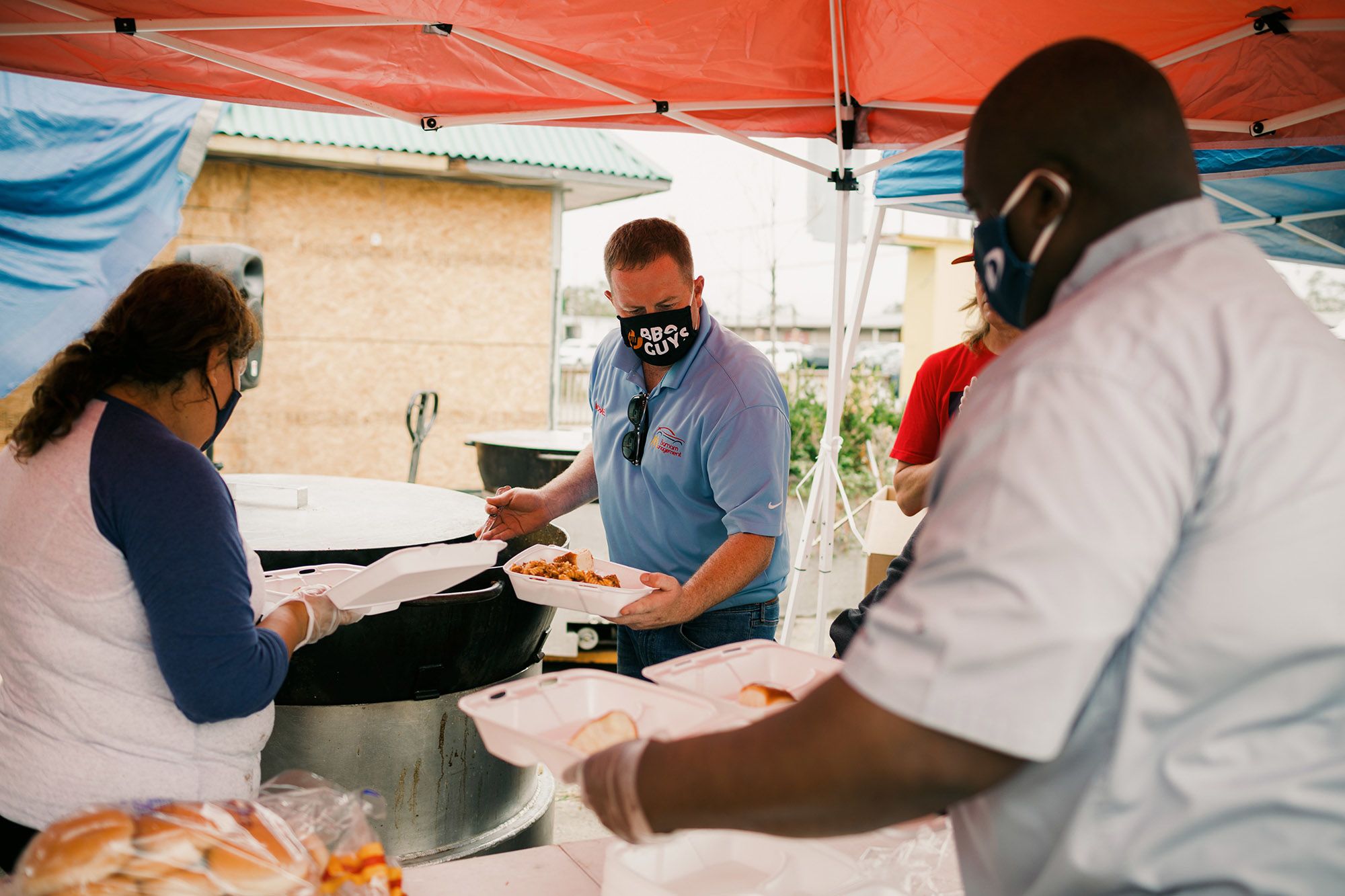 Michael Boyer, center, has been organizing food drives in Lake Charles. (Bryan Tarnowski for NBC News)