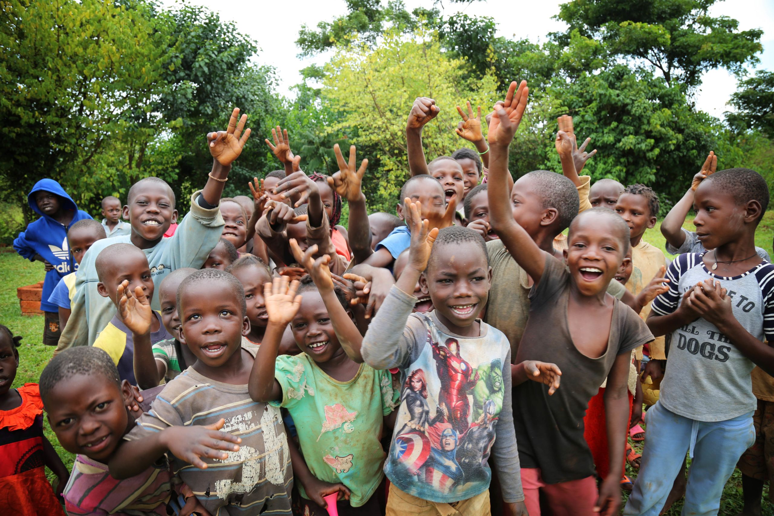 Children laugh and cheer as vaccines are distributed