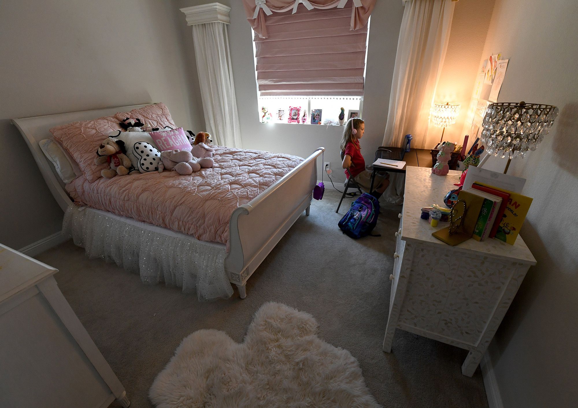 Fourth grader Reaghan Keeler, 9, attends an online reading class on her first day of distance learning in Las Vegas.