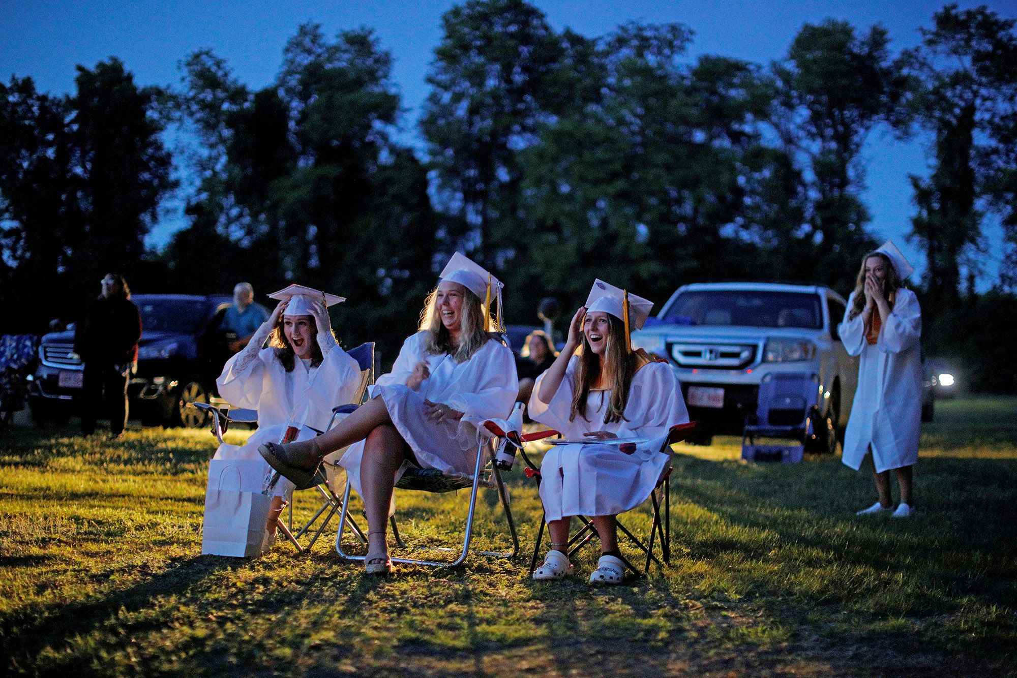 Seniors watch a video retrospective of their time in high school during Pioneer Valley Regional School's graduation, which was held in the Northfield Drive-In Theate, in Hinsdale, N.H., on June 8.